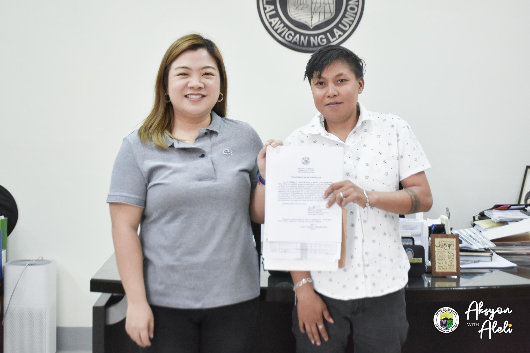 Mayor Aleli Concepcion administers the oath of office of Ms. Gemma Aglosolos